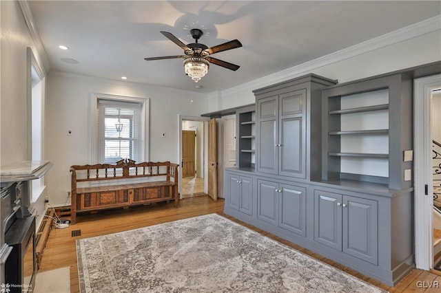 bedroom featuring light hardwood / wood-style floors and crown molding