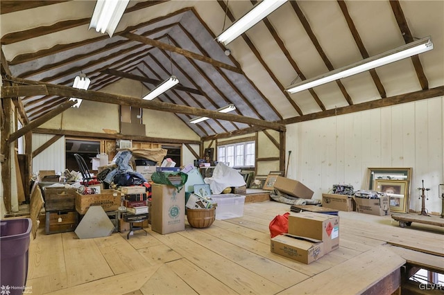 misc room featuring light hardwood / wood-style floors and high vaulted ceiling