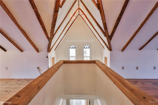 bonus room with hardwood / wood-style flooring, high vaulted ceiling, and beam ceiling