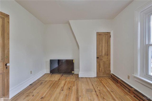 unfurnished living room with light hardwood / wood-style flooring