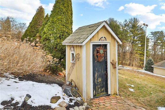 view of outbuilding featuring a yard