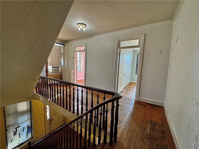 hall with cooling unit, crown molding, and wood-type flooring