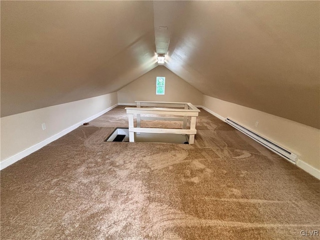 bonus room with vaulted ceiling, carpet floors, and a baseboard heating unit