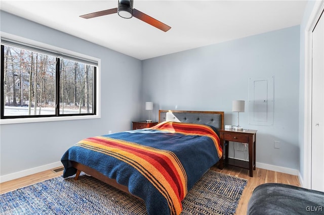 bedroom featuring ceiling fan and light hardwood / wood-style flooring