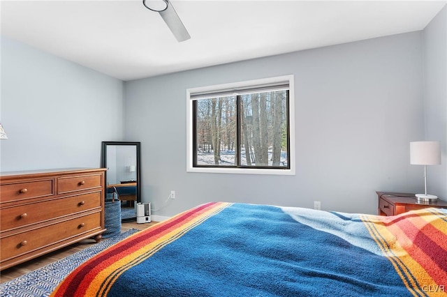 bedroom featuring hardwood / wood-style flooring and ceiling fan