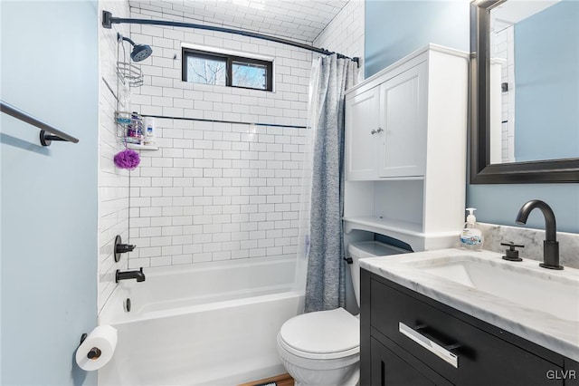 full bathroom with vanity, shower / bath combo, and toilet