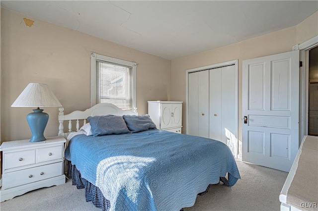 carpeted bedroom featuring a closet