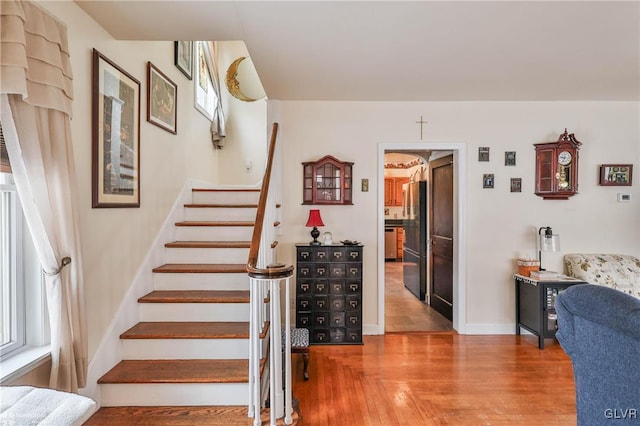 stairs with wood-type flooring