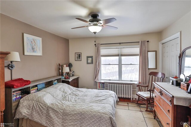 bedroom featuring radiator and ceiling fan