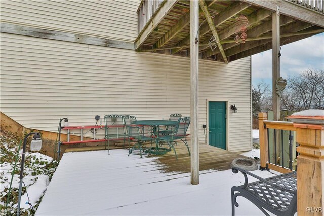 view of snow covered deck