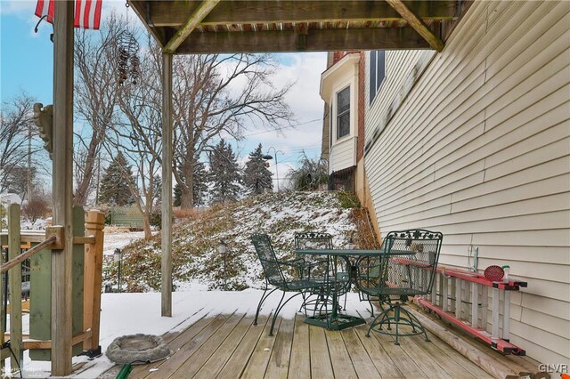 view of snow covered deck