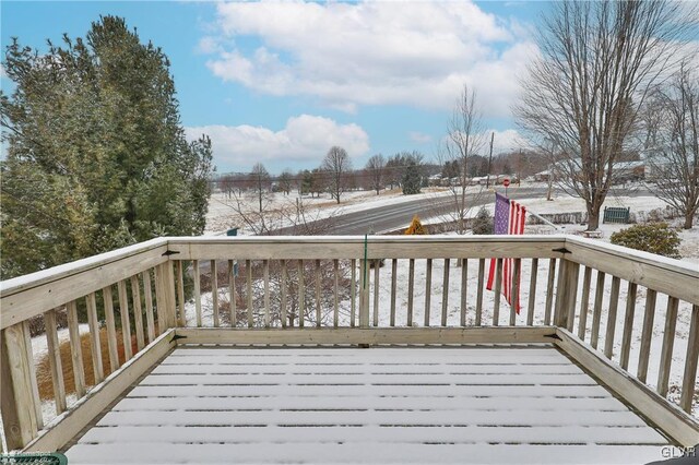 view of snow covered deck