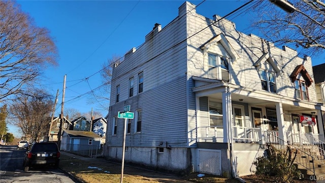 view of side of home featuring a porch