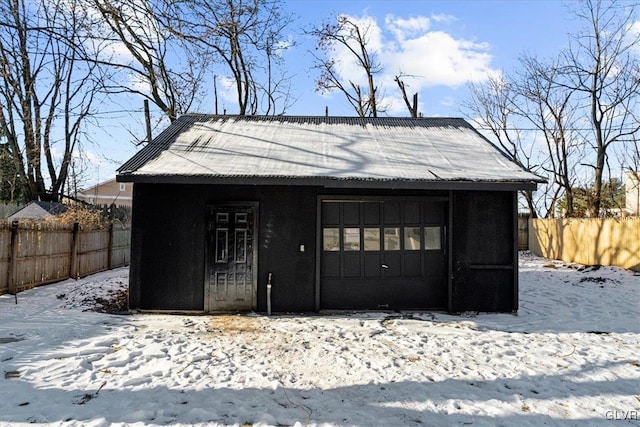 view of snow covered garage