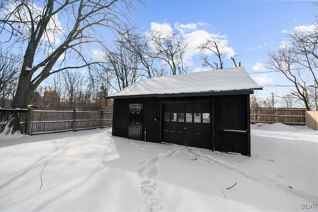 view of snow covered garage