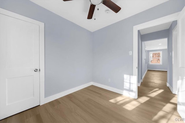 spare room featuring ceiling fan and light hardwood / wood-style flooring