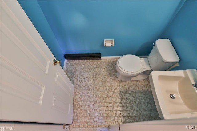 bathroom featuring sink and toilet