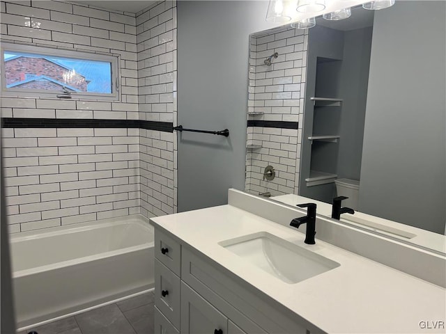 bathroom featuring tiled shower / bath combo and vanity