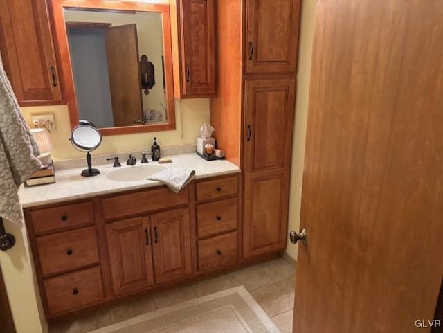 bathroom with tile patterned floors and vanity