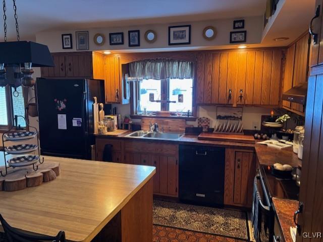 kitchen featuring sink and black appliances