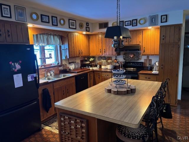 kitchen with sink and black appliances