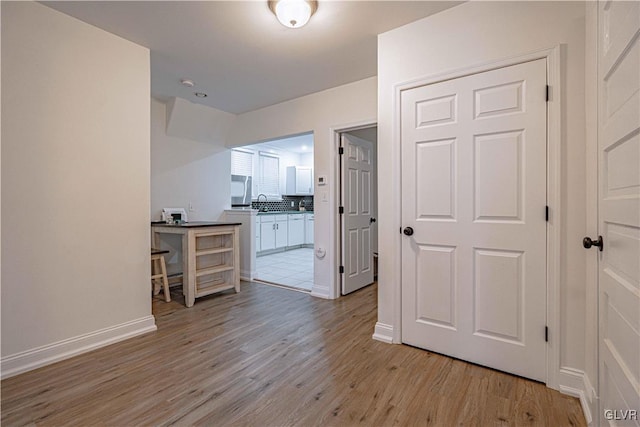 hall featuring light hardwood / wood-style flooring