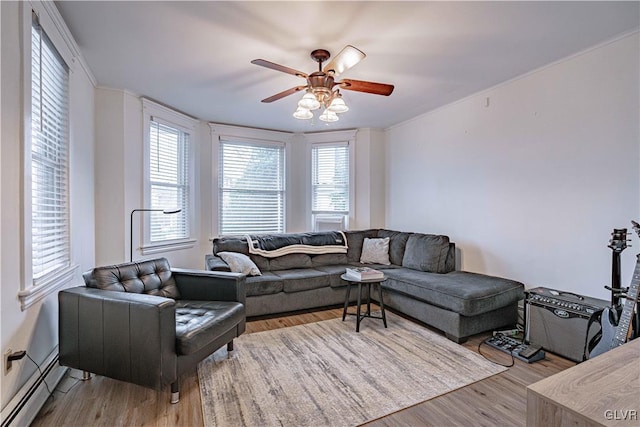 living room featuring ceiling fan, baseboard heating, and light hardwood / wood-style floors