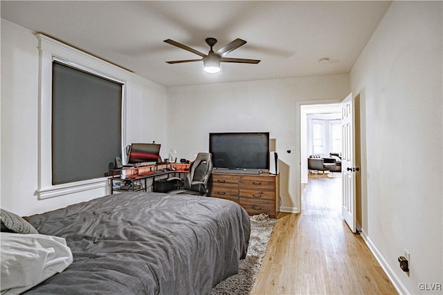 bedroom featuring ceiling fan and light hardwood / wood-style floors