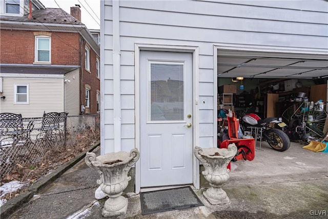 view of exterior entry with a garage