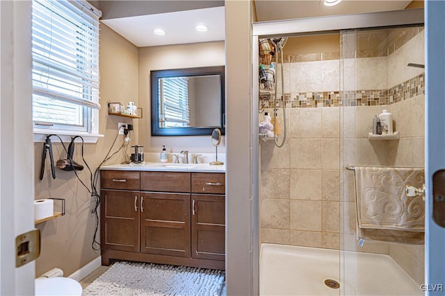 bathroom featuring vanity and a shower with shower door