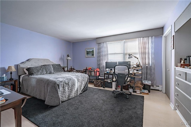 bedroom with a baseboard heating unit