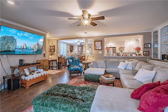 living room featuring crown molding, ceiling fan, and dark hardwood / wood-style floors