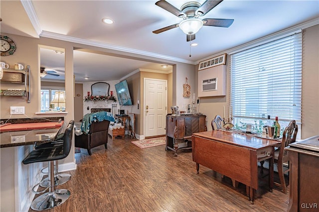 office space with ornamental molding, an AC wall unit, dark hardwood / wood-style floors, and ceiling fan