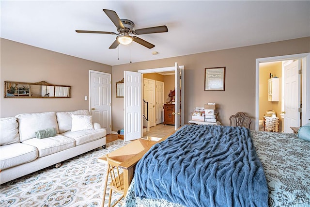 bedroom with ensuite bathroom and ceiling fan