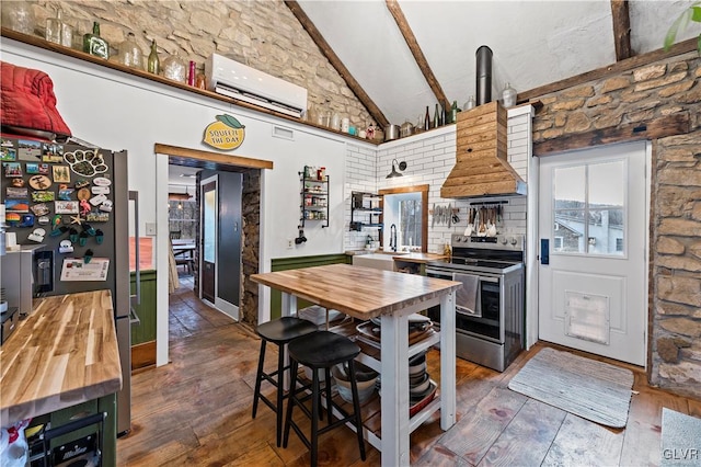 kitchen featuring stainless steel appliances, dark wood-type flooring, a wall mounted air conditioner, and wood counters