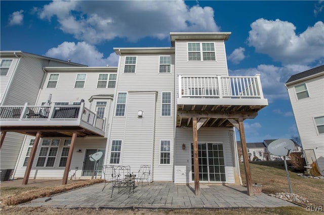 rear view of house with a patio