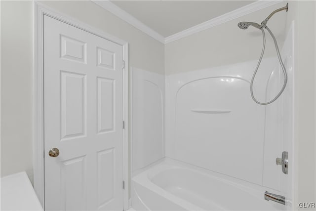 bathroom with crown molding and  shower combination