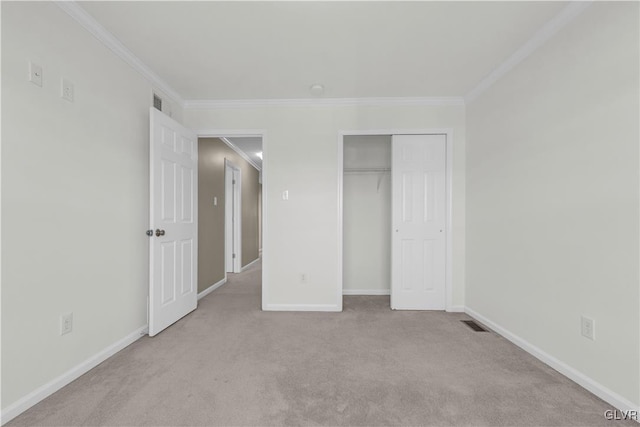 unfurnished bedroom with a closet, ornamental molding, and light carpet