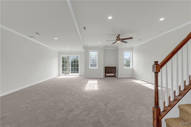 unfurnished living room featuring crown molding, light carpet, and ceiling fan