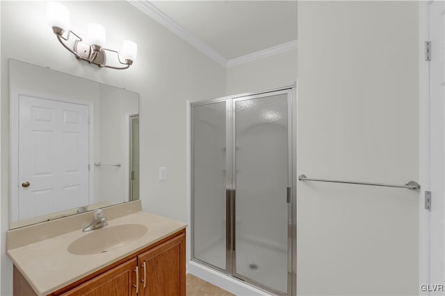 bathroom featuring vanity, crown molding, and a shower with shower door