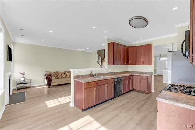 kitchen featuring black dishwasher, sink, stainless steel fridge, crown molding, and light wood-type flooring