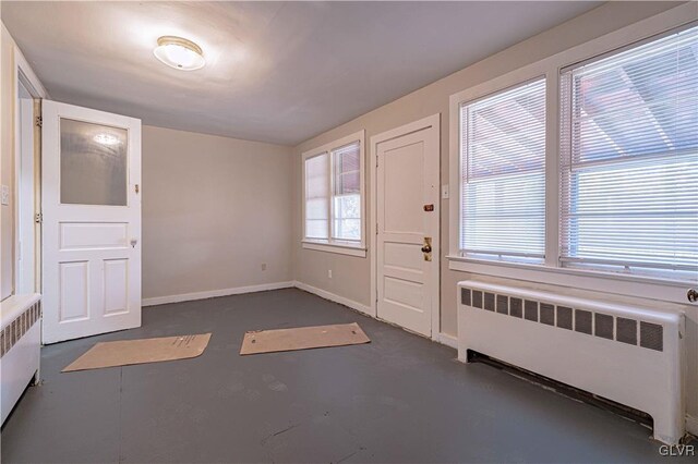 foyer entrance featuring radiator