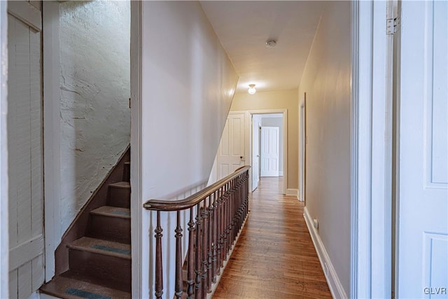 stairway featuring hardwood / wood-style floors