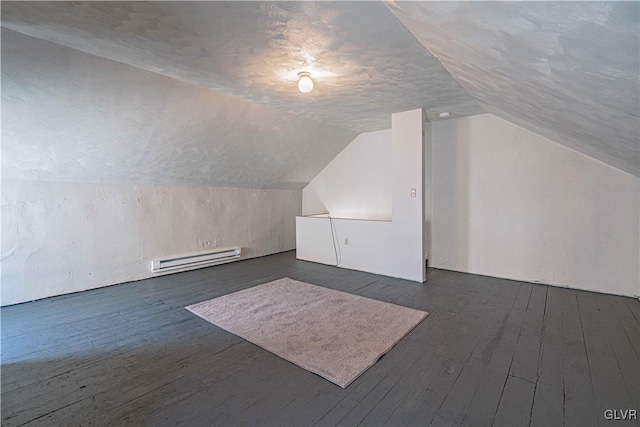 bonus room with dark hardwood / wood-style flooring, a baseboard radiator, and lofted ceiling