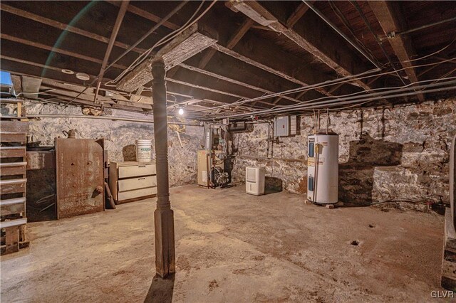 basement featuring water heater and electric panel