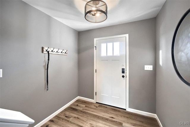 entryway with hardwood / wood-style flooring