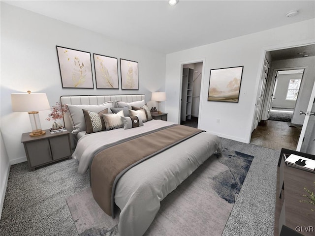 bedroom featuring a walk in closet