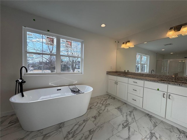 bathroom featuring vanity and shower with separate bathtub