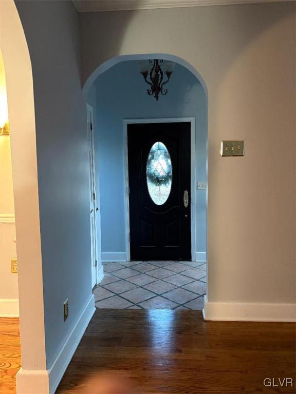 entryway with hardwood / wood-style flooring