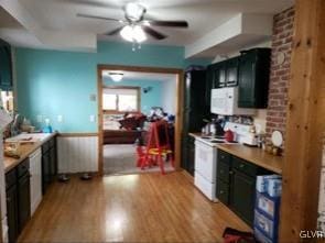 kitchen featuring ceiling fan, light wood-type flooring, and white appliances